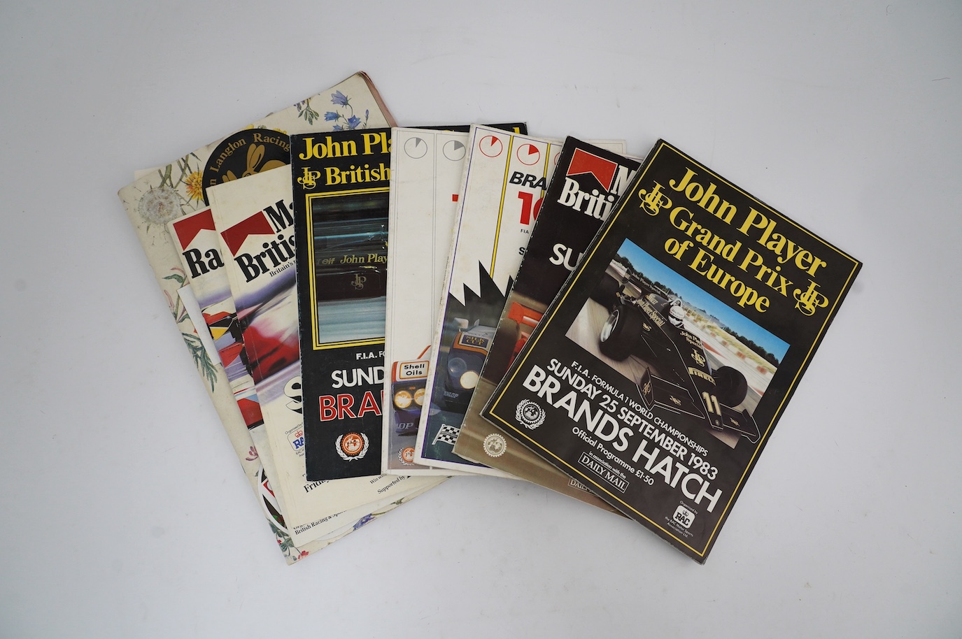 An archive of British Grand Prix memorabilia from Brands Hatch, including a collection of autographs, including Niki Lauda, John Watson, etc., all collected in a brands Hatch official program dated 1983 by the vendor who